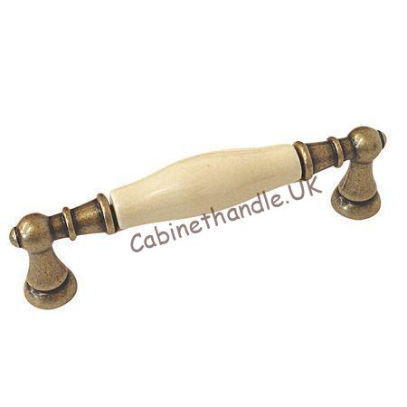 antique brass and cream ceramic kitchen handle